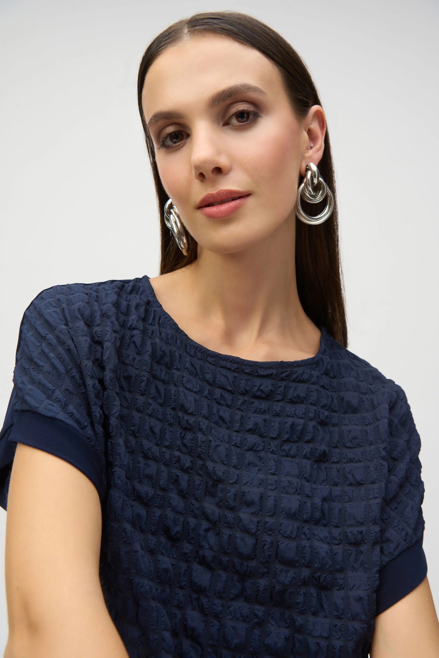 Bubble Jacquard & Silky Knit High Low Top. Style JR252213