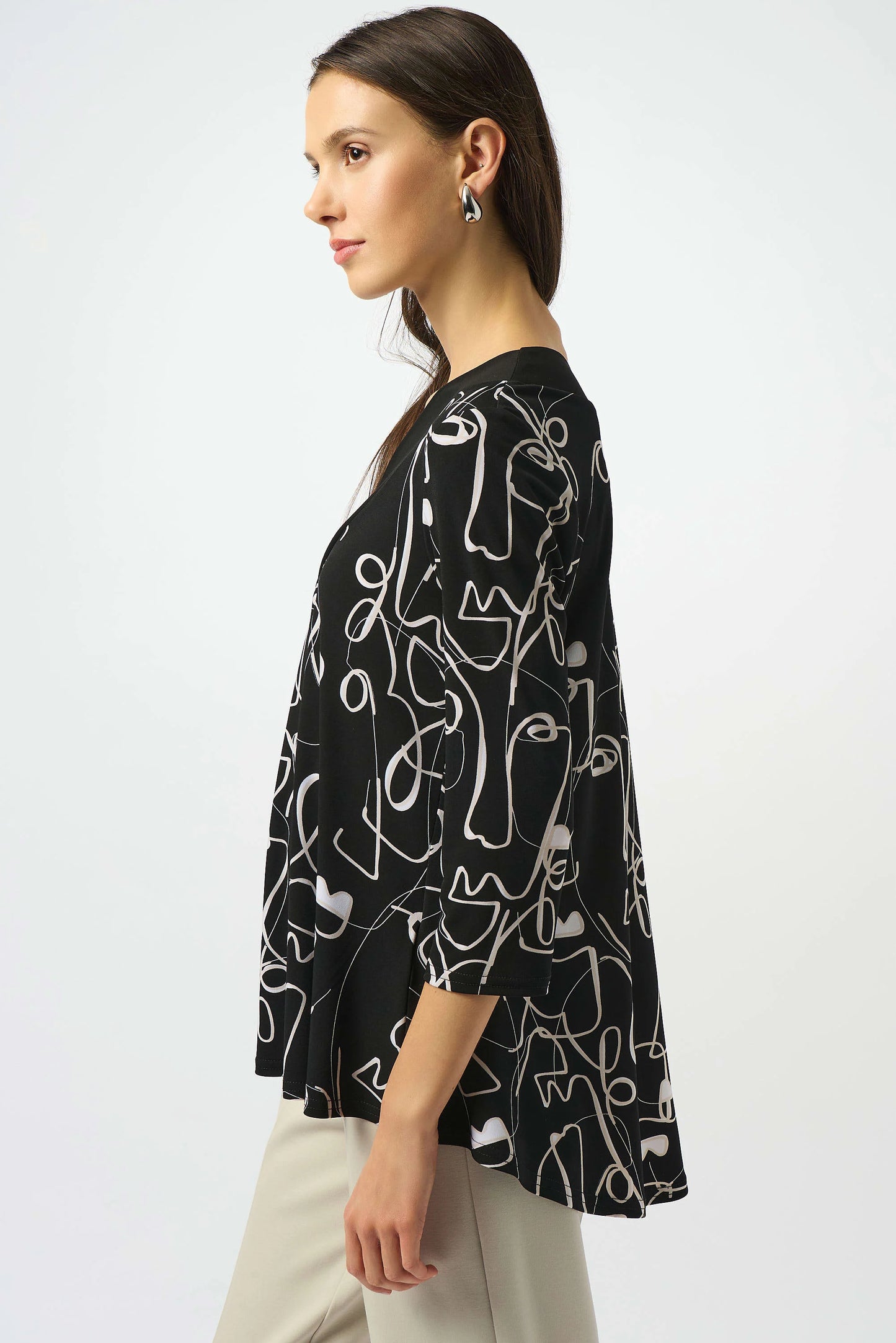 Silky Knit Face Print Flared Top. Style JR253138