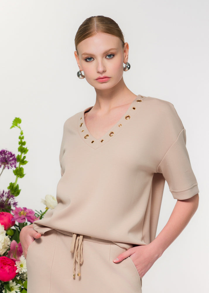 Grommet Detailing Short Sleeve Stretch Sweater. Style EW36042
